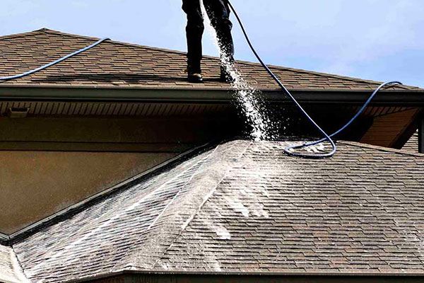 Softwashing residential house roof